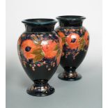 A particularly large pair of Moorcroft Pomegranate pattern vases, of inverted baluster form with