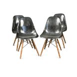 Charles and Ray Eames for Herman Miller, a set of four modern shell chairs, the moulded black