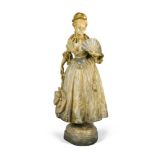A Goldscheider Art Nouveau cold painted pottery figure of a young woman, modelled in 18th century