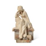 A continental Art Deco neo-Egyptian style carved alabaster seated figure, modelled as a young