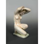 A large Goldscheider nude study, modelled in crouching pose on a rectangular base with black printed