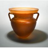 A 20th century Amphora glass urn, the amber glass form speckled with white, unmarked 31cm (12in)