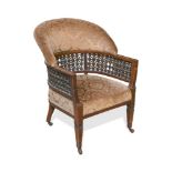 Attributed to Liberty & Co., a late 19th century parlour chair, the rounded upholstered back above