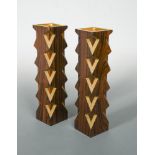 § Stuart Devlin, (Australian, born 1931), a pair of Indian rosewood and parcel gilt candlesticks,