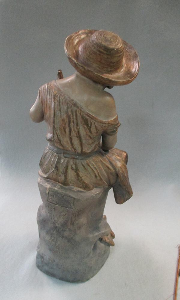 A Goldscheider terracotta model of a young girl fishing, she sits perched upon a rock holding her - Image 5 of 7