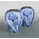 A large pair of early Moorcroft Florian Ware Tulip pattern vases, circa 1900, decorated in shades of