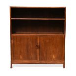 A Cotswold School walnut cabinet, the rectangular top with re-entrant corners above single