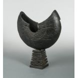 § Paul Clare, (British, 20th century), a burr oak sculptural form, the dark stained elliptical top