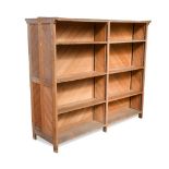 A late 19th century oak double sided bookcase, each side with two sections of adjustable shelves,