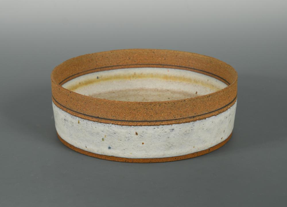 § Robin Welch, (British, born 1936), a stoneware bowl, of straight sided circular form, impressed