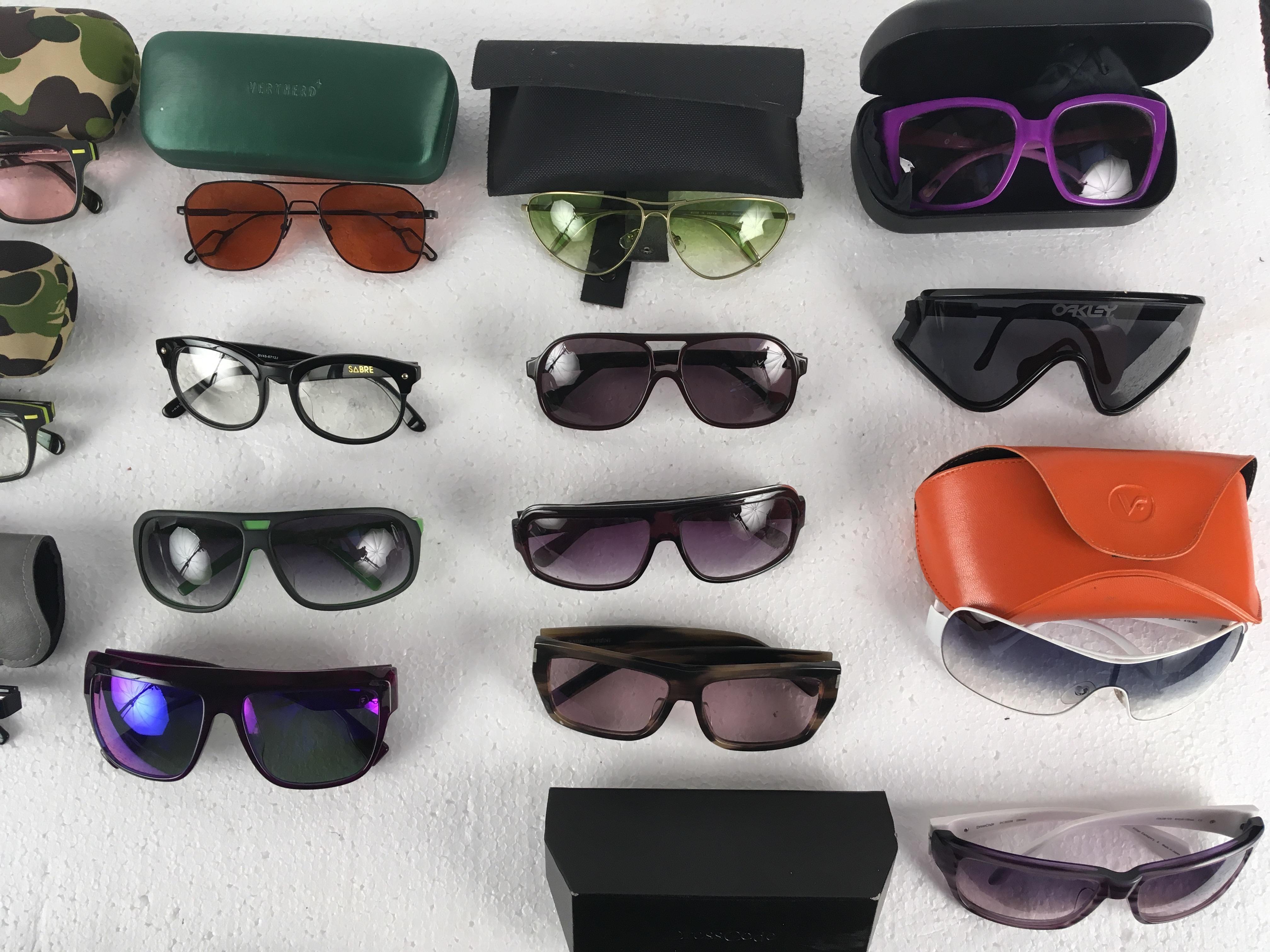 A collection of mostly designer sunglasses, to include; Alexander McQueen, Prada, A Bathing Ape, - Image 6 of 10