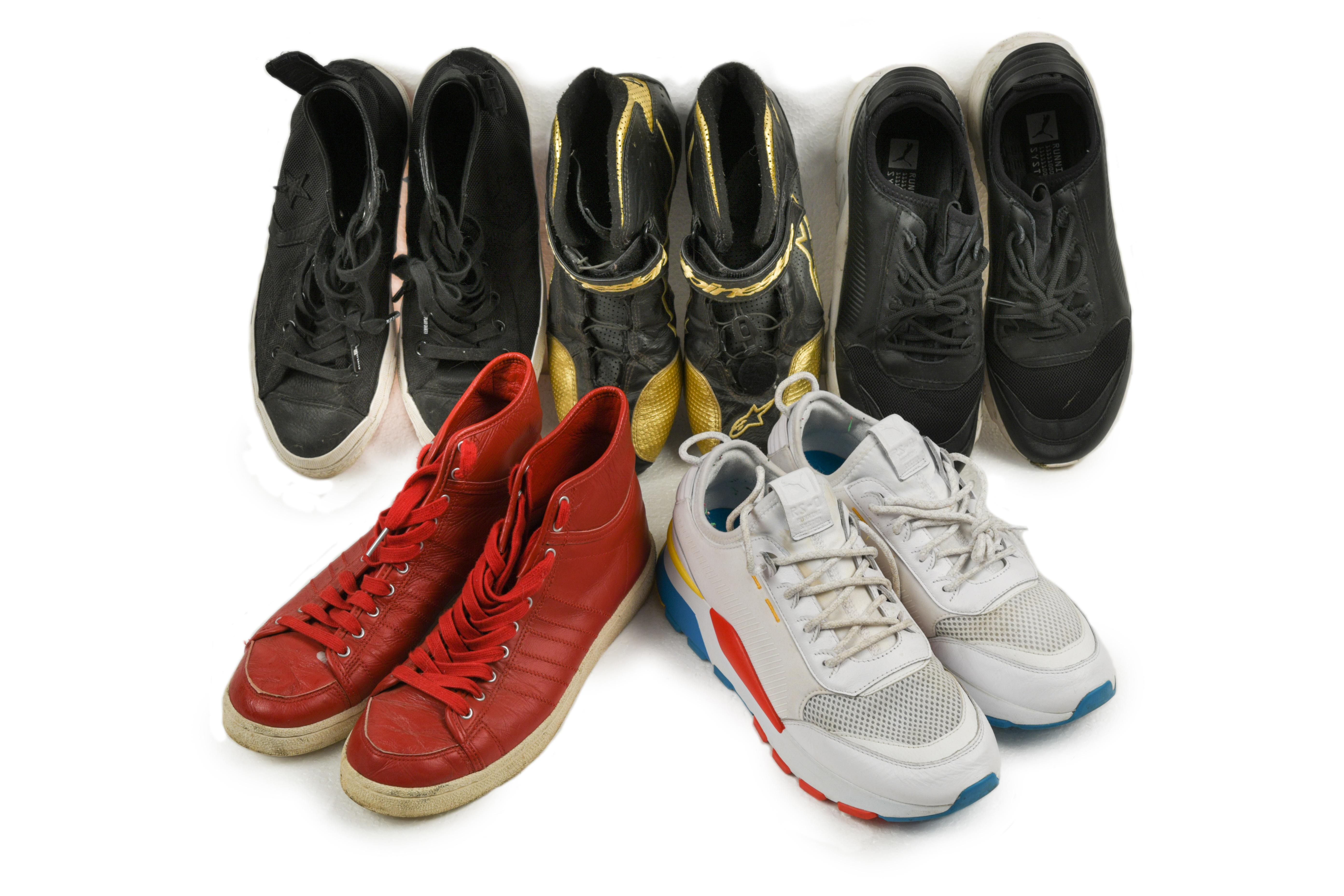 Five pairs of trainers, to include; two pairs of Puma, a pair of Adidas red hi tops, a pair of black