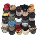 A collection of thirty six assorted flat caps, comprising leather and tweed, to include brands