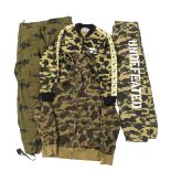 A Bathing Ape (BAPE) a quantity of green camouflage clothing, to include; hoodies, tracksuit