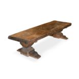 A rustic oak low coffee table, with adzed top 50 x 208 x 65cm (20 x 81 x 25in)