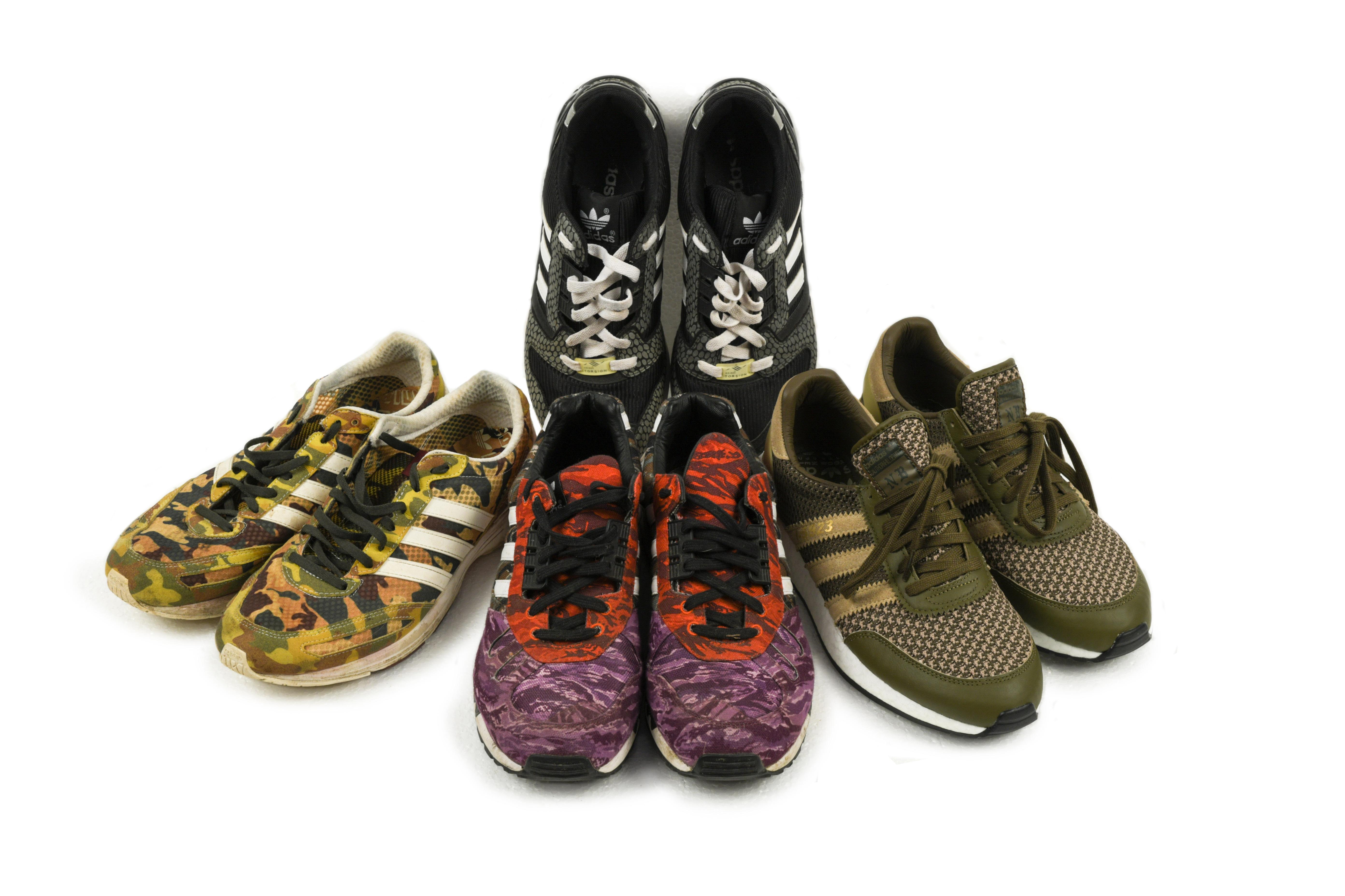 Adidas, a pair of Black Scale ZX7000 trainers, size 9, together with three other pairs of Adidas