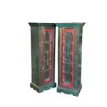 A pair of painted narrow cupboards, decorated with heraldic motifs and fleur de lys 134 x 48cm (52 x