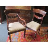 A set of Six William IV mahogany dining chairs including two armchairs, with swag back-rest