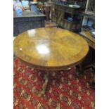 An early 19th century mahogany and rosewood tripod supper table 106cm wide