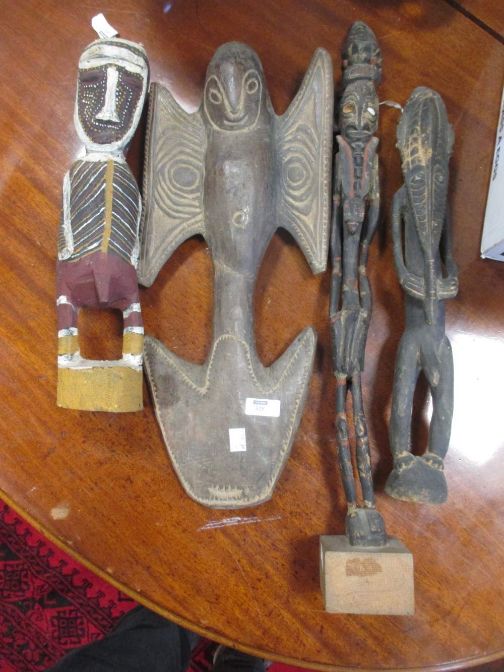 Seven various carved wood tribal figures