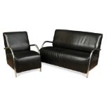 A contemporary black vinyl and chrome three-piece suite, comprising a two-seat sofa and a pair of