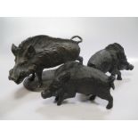 After Mene, a bronze figure of a boar 31cm long, together with a pair of bronze boars (3)
