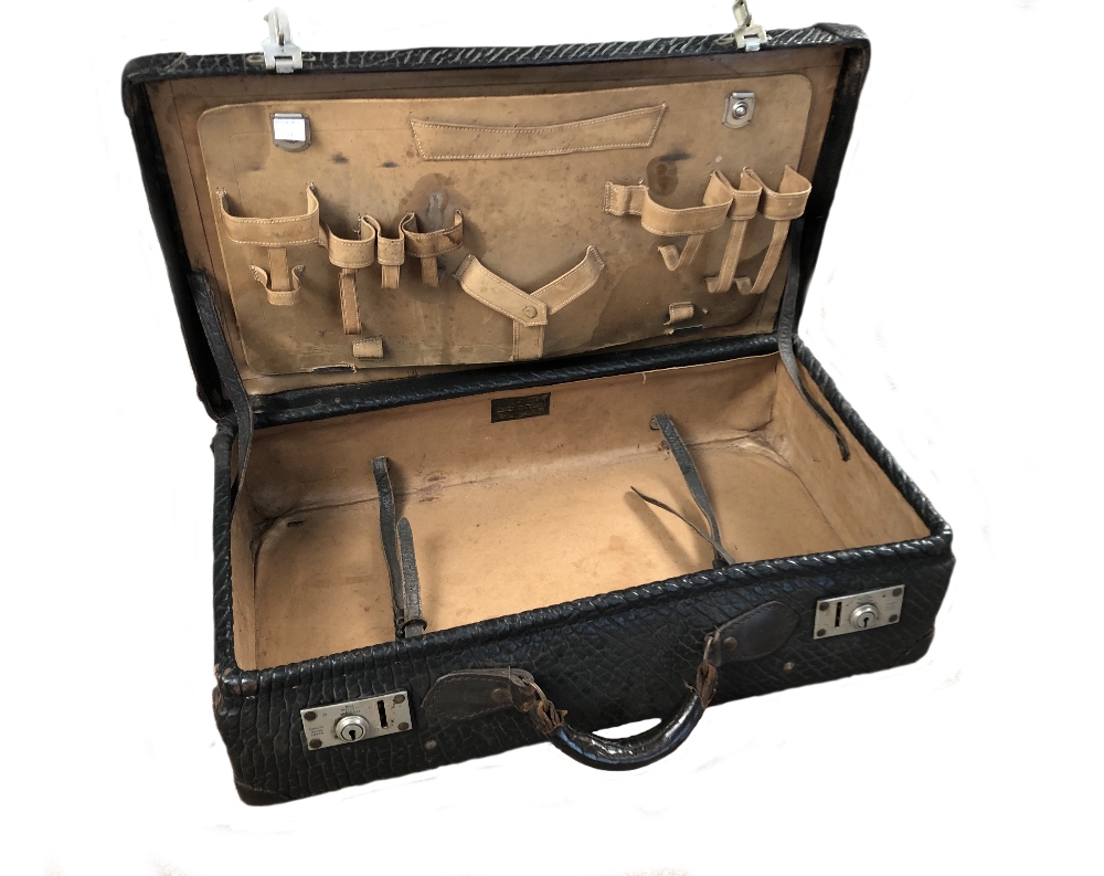 An early 20th century Bull Sea Lion leather vanity case, lacking fittings, label to interior 36 x