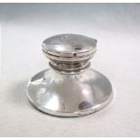 A 20th century silver capstan inkwell, with hinged cover and glass reservoir, loaded