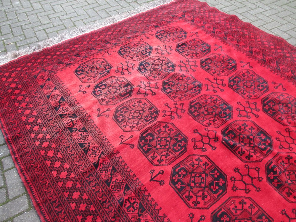 A red ground Afghan type rug 330 x 238cm - Image 4 of 4