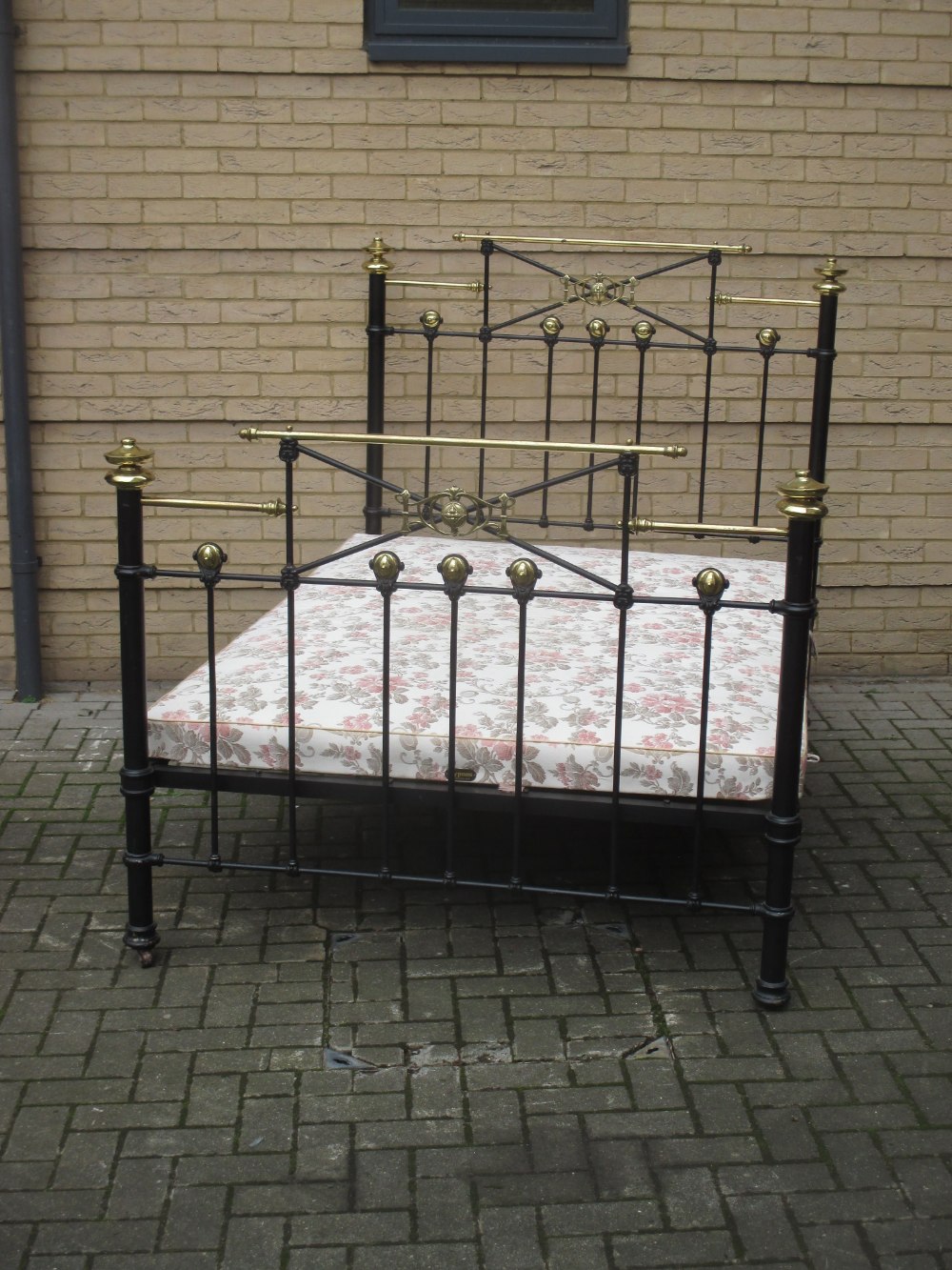 A 19th century brass and iron bedstead