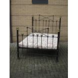 A 19th century brass and iron bedstead