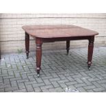 A 19th Century mahogany extending dining table