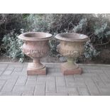 A pair of terracotta garden urns 44cm high 39cm wide (2)