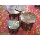 Three early 20th century Indian brass inlaid octagonal occasional tables on folding stands,