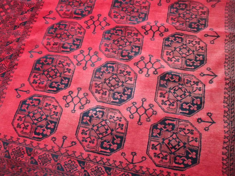 A red ground Afghan type rug 330 x 238cm - Image 3 of 4