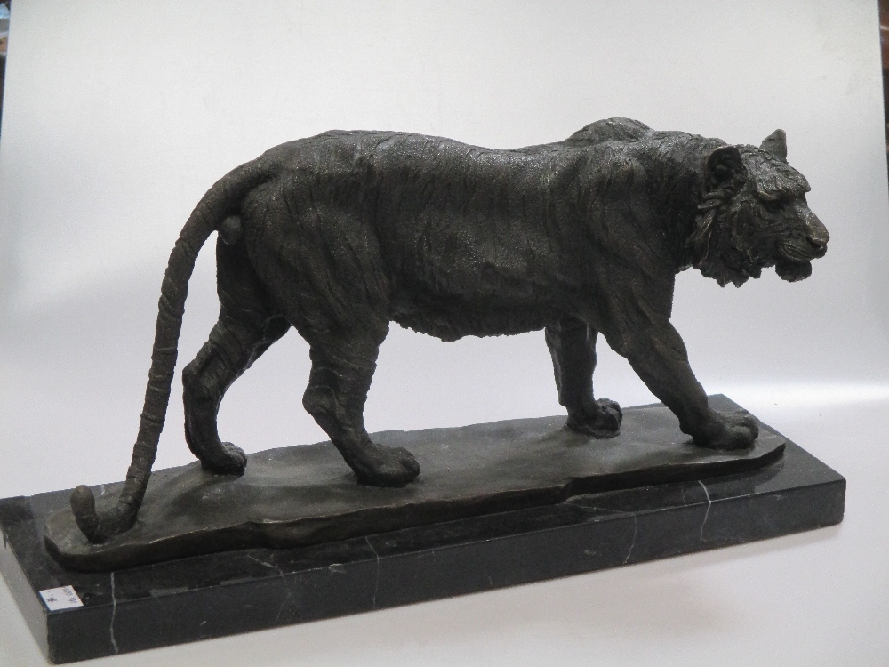 A Japanese style bronze figure of a tiger on marble base 46cm long overall