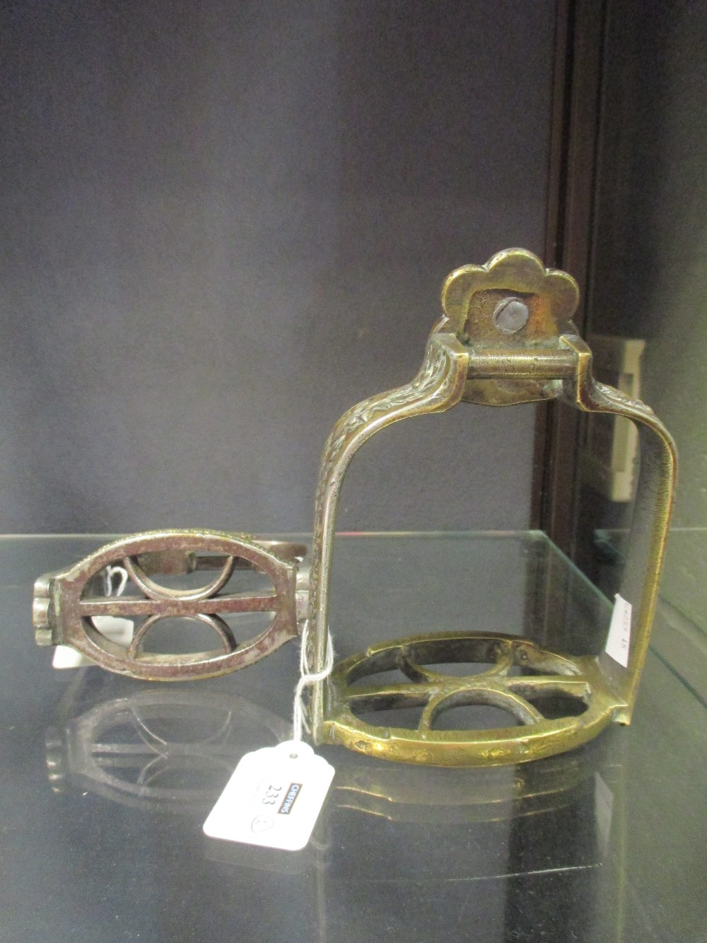 A matched pair of 19th century bronze, brass and copper regimental stirrups (2)