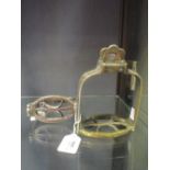 A matched pair of 19th century bronze, brass and copper regimental stirrups (2)