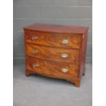 An early 19th century mahogany bow fronted chest of drawers on bracket feet 83 x 94 x 53cm