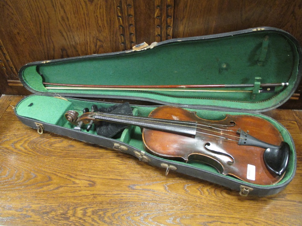 A German violin with Stradivarius label (full size) cased Signs of repair and damage