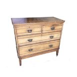 A late 19th century ash chest of drawers by Lamb of Manchester, with two short and two long