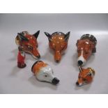 A Royal Stratford porcelain fox head stirrup cup and five other similar (6)