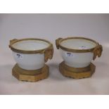 A pair of modern Czechoslavakian white porcelain and ormolu mounted vases with Rams Head handles,