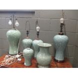 Five Chinese celadon vases decorated with cranes, converted to lamps 45cm high the tallest and a