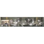 A large collection of silver plated ware to include entree dishes, trays, bottle coaster,