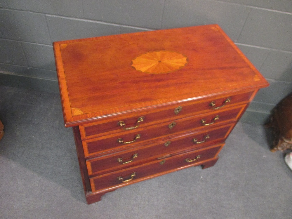 A George III mahogany and crossbanded chest of four long graduating drawers on bracket feet 79 x - Image 2 of 3