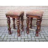 A pair of turned wood and brass mounted heavy bar stools