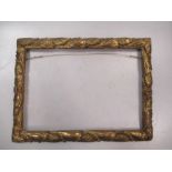 An Italian 19th Century carved and giltwood frame with running acanthus leaf patter, sight size 19 x