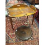 A later 19th century mahogany folding butler's tray and a 19th century piecrust wine table top