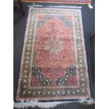 A modern silk rug of pink madder grounds 58 x 98 cm